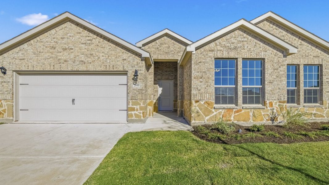 Front exterior of a new home in The Woods at Lindsey Place, Anna, TX, highlighting curb appeal (Image 1). Front exterior of a new home in The Woods at Lindsey Place, Anna, TX, highlighting curb appeal (Image 1).