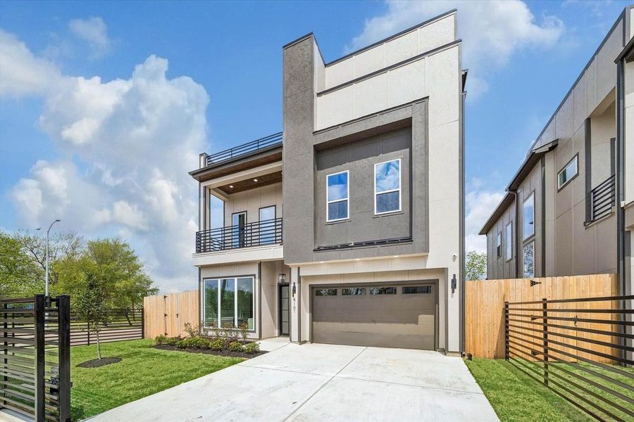 Kewanee St was beautifully designed! This property features nice sized front and backyard. Iron gate, balconies and 3rd floor deck. Builder thought of everything!