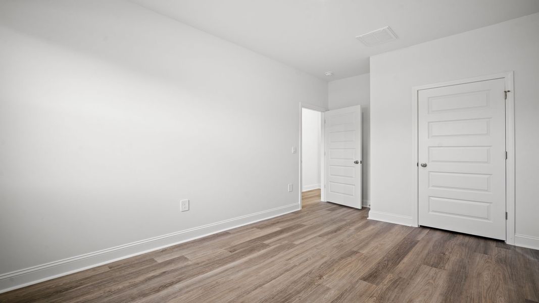 Representative unfurnished interior of a home built from the Hemingway-Exp by D.R. Horton in The Lakes at North Glynn, Brunswick (Image 28).