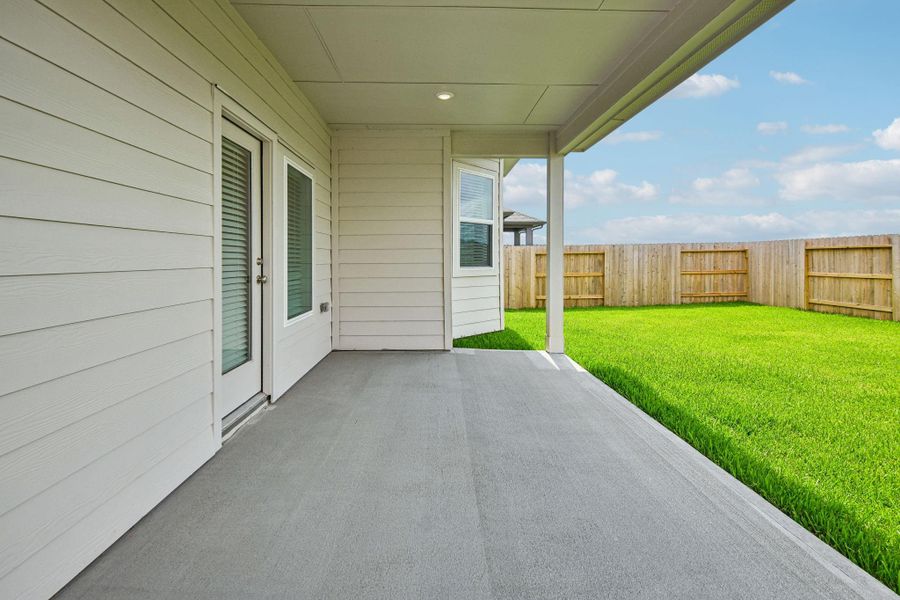 Exterior details and patio area of a home in Riviera Pines - Premier Series, Huffman (Image 24).