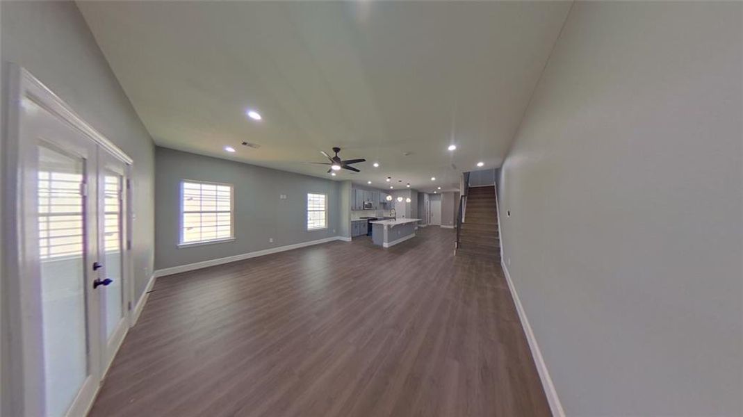 7918 James Franklin St spacious living with French doors to the wide back patio.