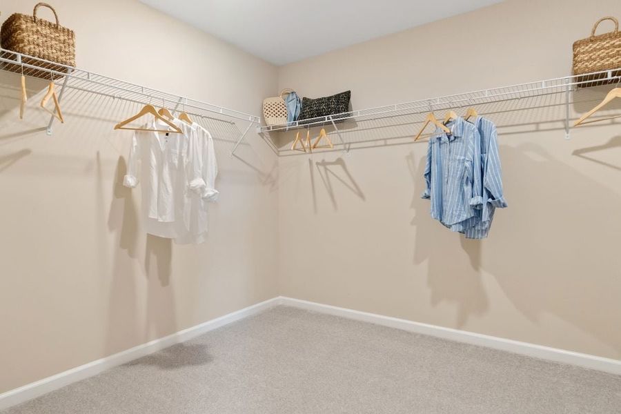 Spacious walk-in closet at primary suite