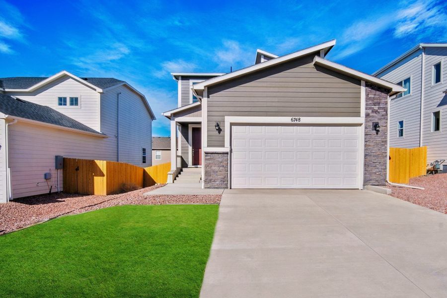 Front exterior of a new home in Ridge at Lorson Ranch, Colorado Springs, CO, highlighting curb appeal (Image 25).