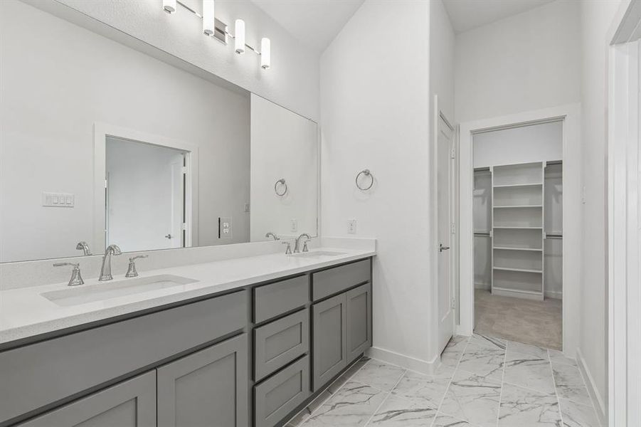 Primary Bathroom in the Claret home plan by Trophy Signature Homes – REPRESENTATIVE PHOTO