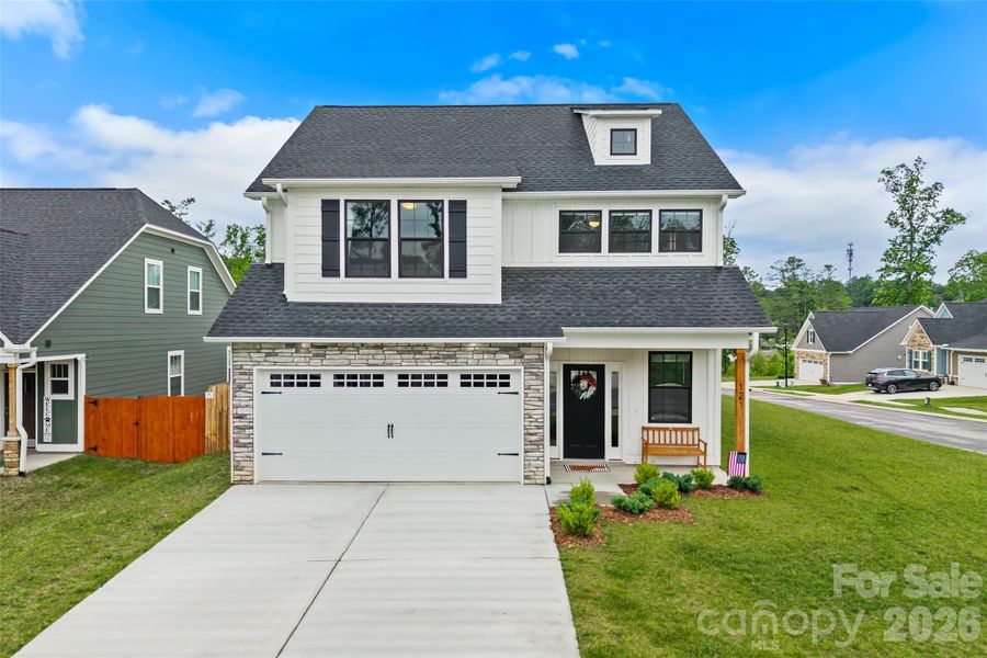 Front exterior of a new home in , Fletcher, NC, highlighting curb appeal (Image 1). Front exterior of a new home in , Fletcher, NC, highlighting curb appeal (Image 1).