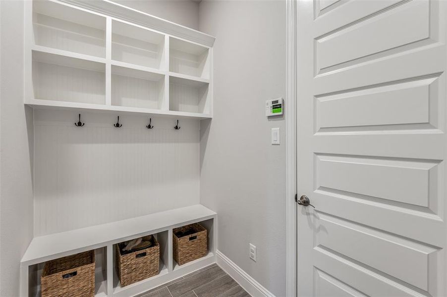 Mudroom with dark wood-type flooring