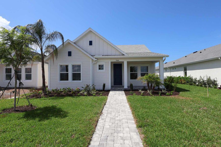 Representative exterior photo of a completed home built from the The Bellmeade by David Weekley Homes in SeaFlower – Bungalow Homes, Bradenton, FL (Image 10). Representative exterior photo of a completed home built from the The Bellmeade by David Weekley Homes in SeaFlower – Bungalow Homes, Bradenton, FL (Image 10).