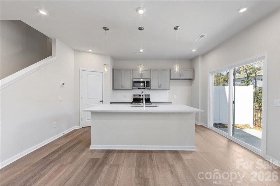 Kitchen with Island featuring a large Sink Kitchen with Island featuring a large Sink
