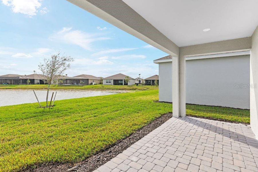Exterior details and patio area of a home in The Cove at West Port, Port Charlotte (Image 3).