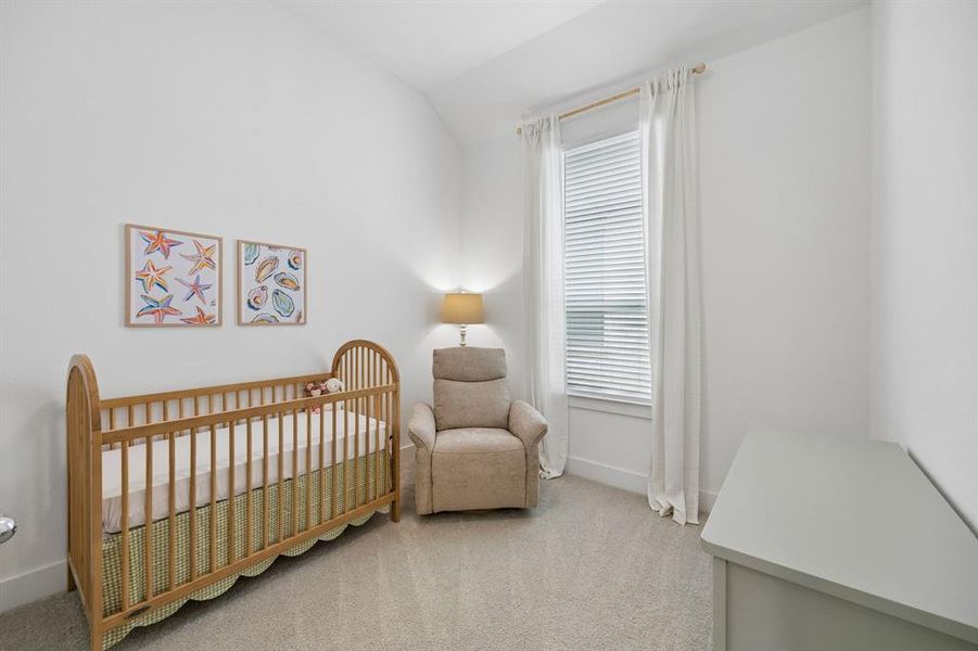 Bright interior with high ceilings and light gray carpeting