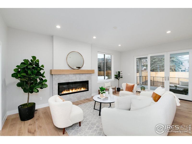 Open living room with cozy luxury electric fireplace.