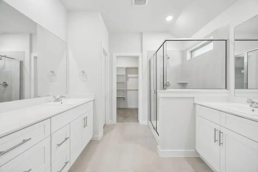 Primary bathroom in the Heisman home plan by Trophy Signature Homes – REPRESENTATIVE PHOTO