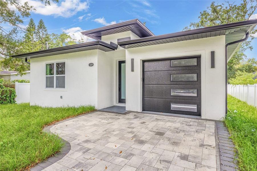 Front exterior of a new home in , Tampa, FL, highlighting curb appeal (Image 25).