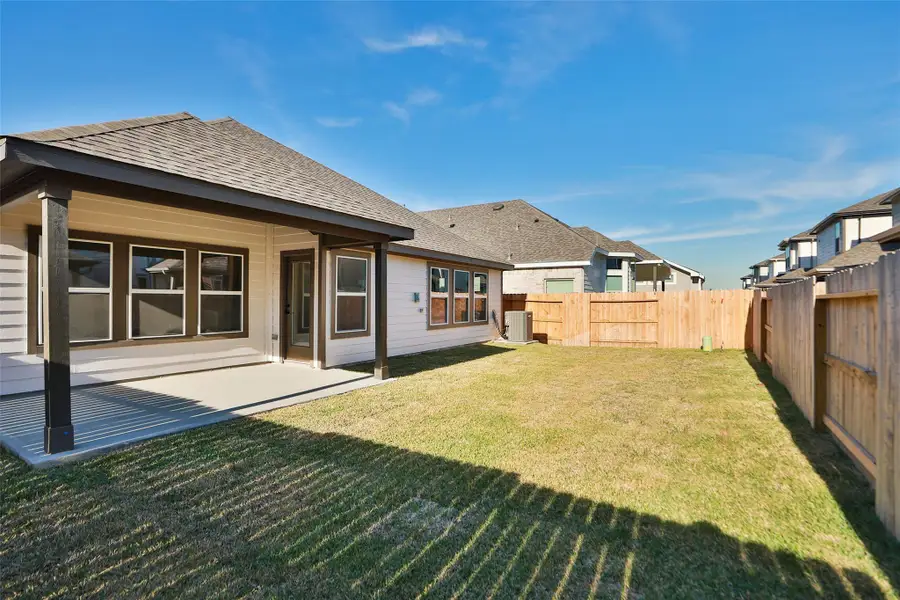Exterior details and patio area of a home in Beamer Villas, Friendswood (Image 3).