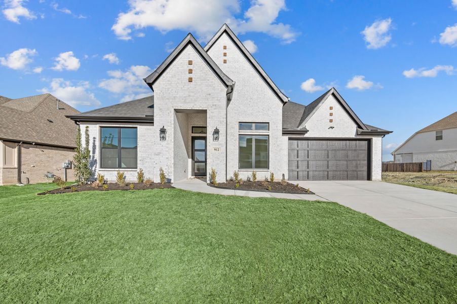 Representative exterior photo of a completed home built from the Micah by Our Country Homes in Rocky Top Ranch, Reno, TX (Image 6).