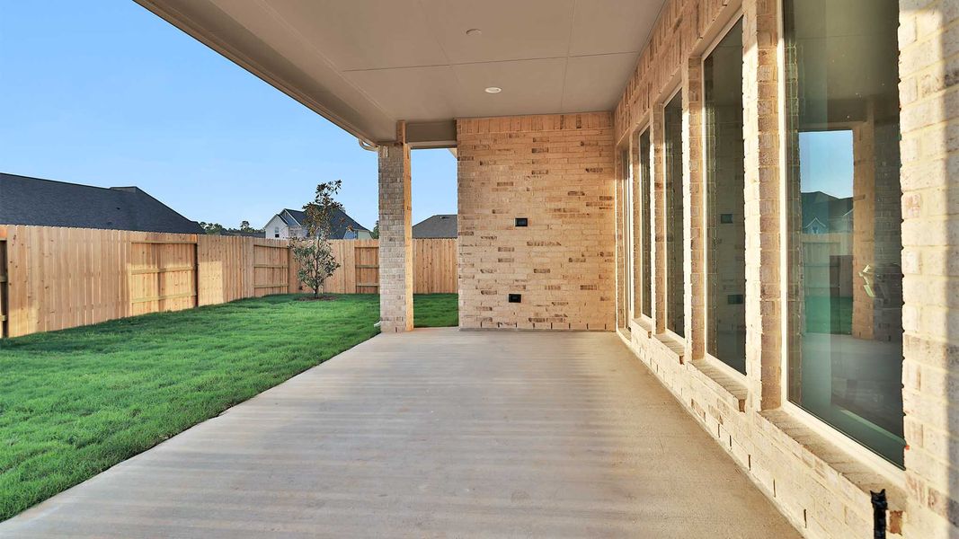 Exterior details and patio area of a home in Artavia, Conroe (Image 3).