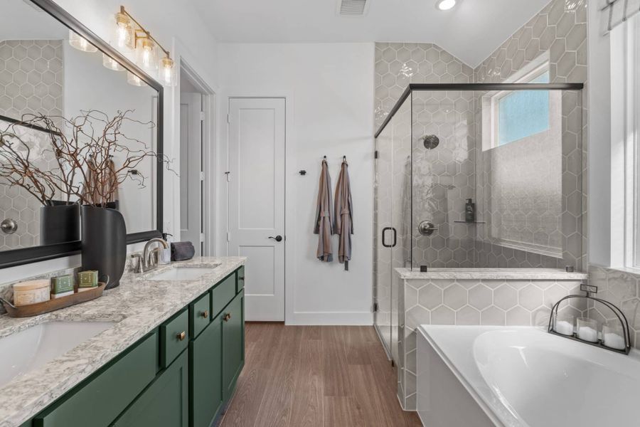 Representative furnished interior of a home built from the Aubrey by Chesmar Homes in Sienna, Missouri City (Image 45).