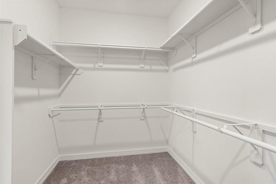 A view of your large primary walk-in Closet