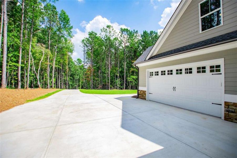 Front exterior of a new home in , Douglasville, GA, highlighting curb appeal (Image 2).