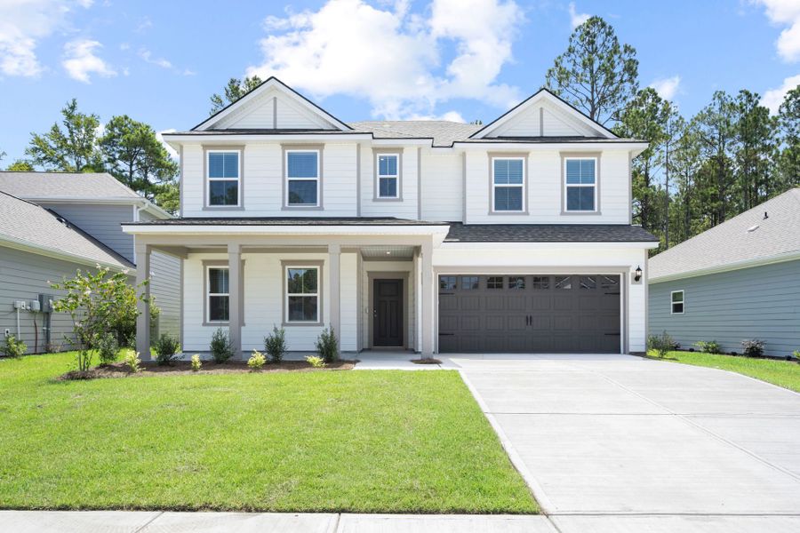 Front exterior of a new home in Waterways, Richmond Hill, GA, highlighting curb appeal (Image 22).