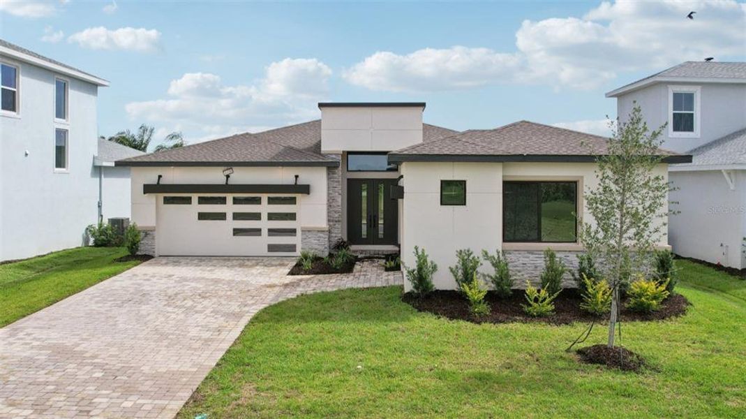 Exterior details and patio area of a home in Biscayne Landing at Seaire, Parrish (Image 1).