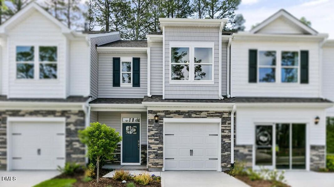 Front exterior of a new home in Chapel Townes, Raleigh, NC, highlighting curb appeal (Image 22). Front exterior of a new home in Chapel Townes, Raleigh, NC, highlighting curb appeal (Image 22).