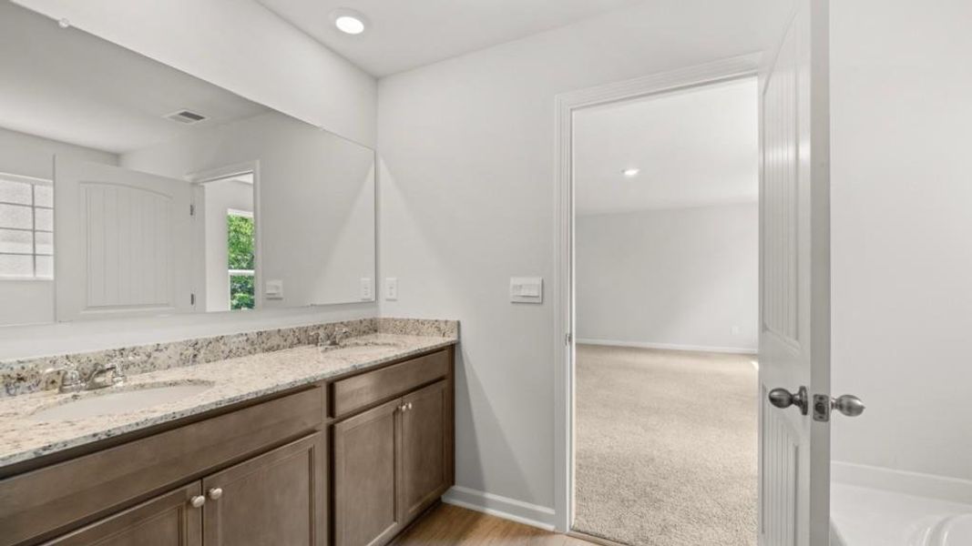 Furnished interior view inside a new home in Northwoods at Mirror Lake, Villa Rica (Image 7).