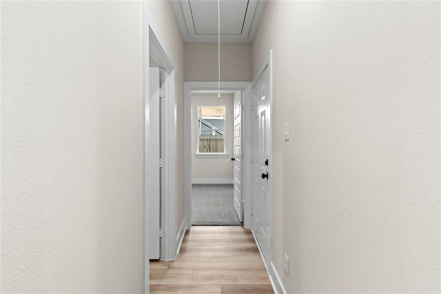 Corridor featuring light wood-type flooring