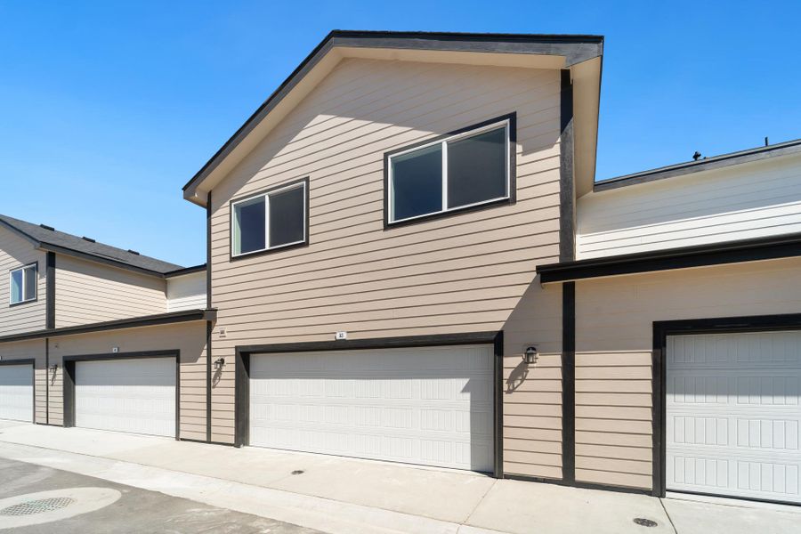 Front exterior of a new home in Conestoga, Ault, CO, highlighting curb appeal (Image 16).
