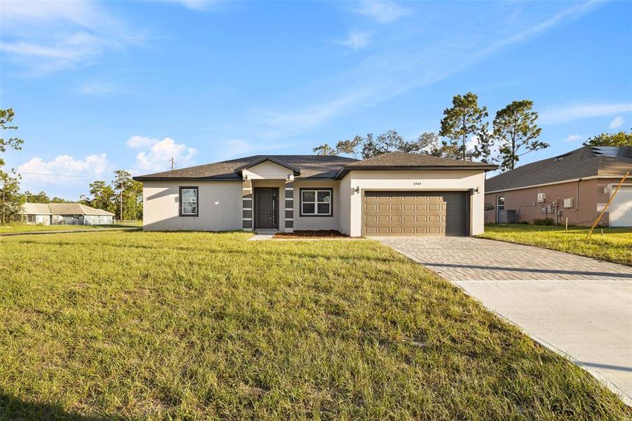 Front exterior of a new home in , Ocala, FL, highlighting curb appeal (Image 22). Front exterior of a new home in , Ocala, FL, highlighting curb appeal (Image 22).