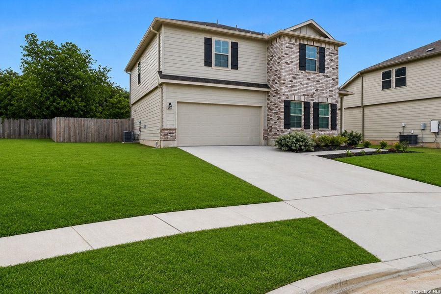 Front exterior of a new home in Greenfield, New Berlin, TX, highlighting curb appeal (Image 1). Front exterior of a new home in Greenfield, New Berlin, TX, highlighting curb appeal (Image 1).