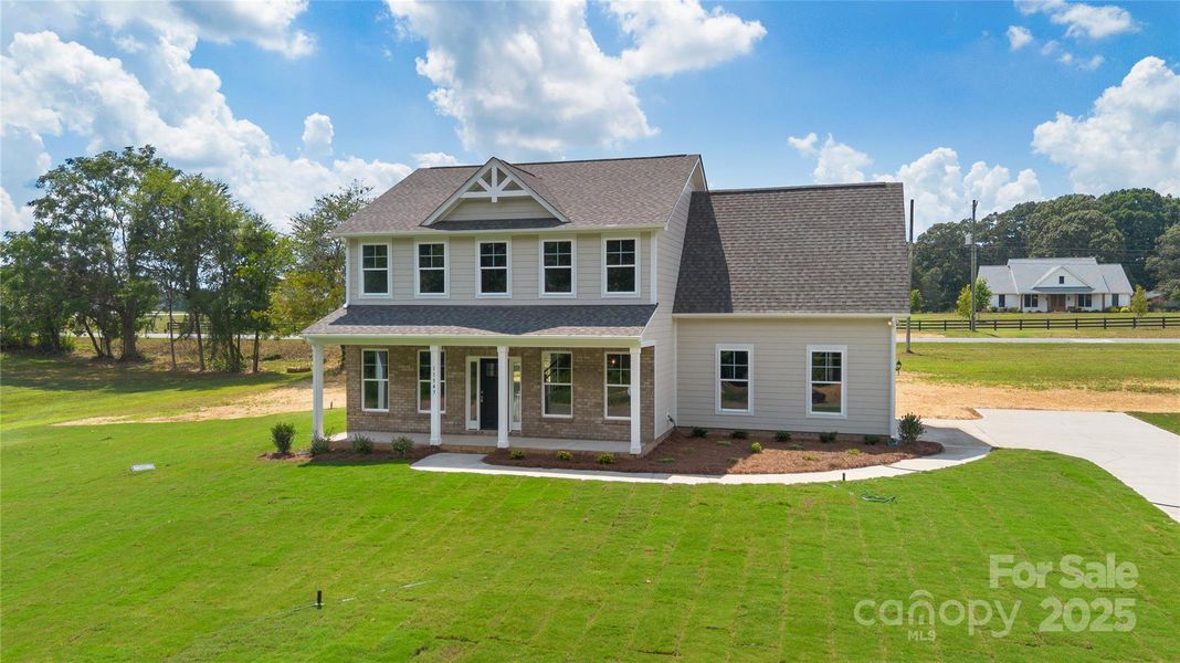 Front exterior of a new home in , Stanfield, NC, highlighting curb appeal (Image 20).