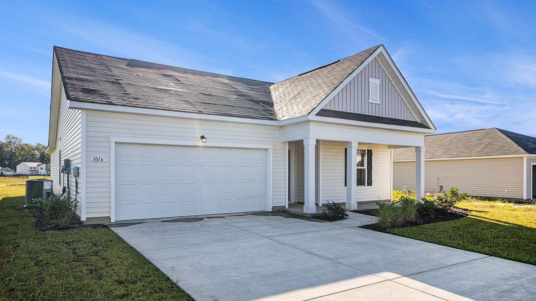 Front exterior of a new home in Ridgefield, Conway, SC, highlighting curb appeal (Image 2). Front exterior of a new home in Ridgefield, Conway, SC, highlighting curb appeal (Image 2).