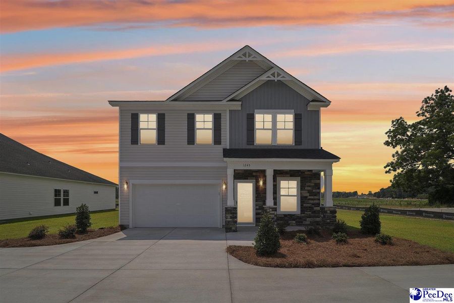 Front exterior of a new home in Southern Columns, Florence, SC, highlighting curb appeal (Image 28).