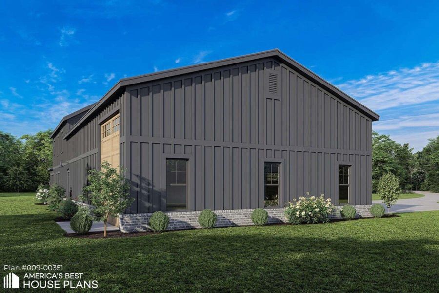 View of property exterior featuring board and batten siding and a yard