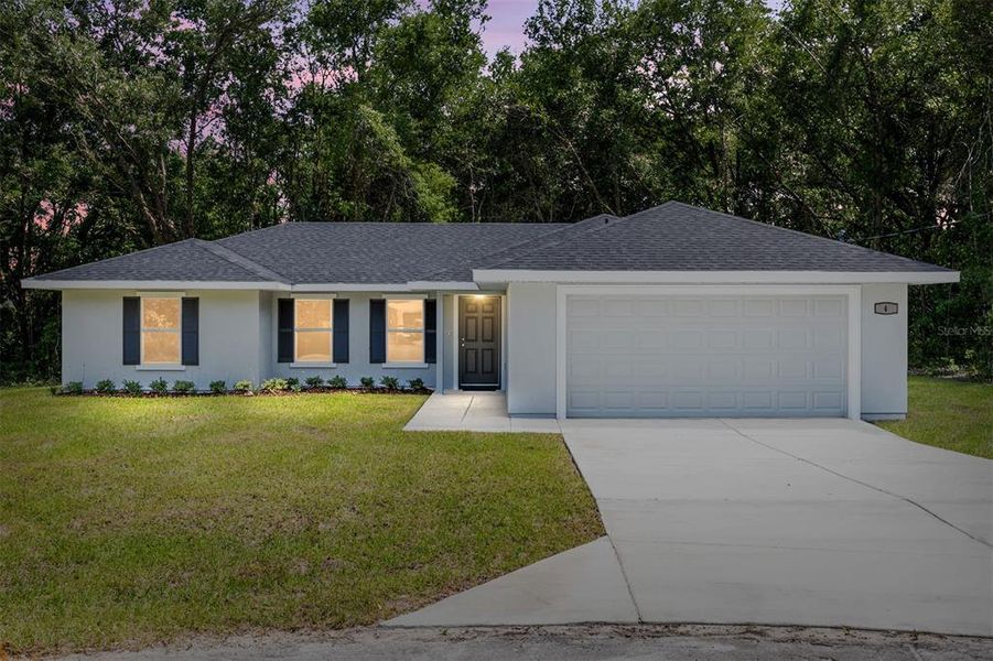 Front exterior of a new home in , Ocala, FL, highlighting curb appeal (Image 21).