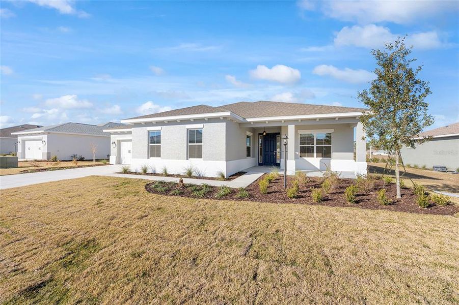 Front exterior of a new home in , Ocala, FL, highlighting curb appeal (Image 20).