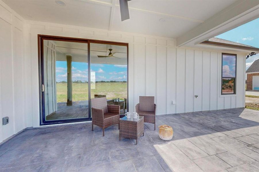 View of patio featuring ceiling fan