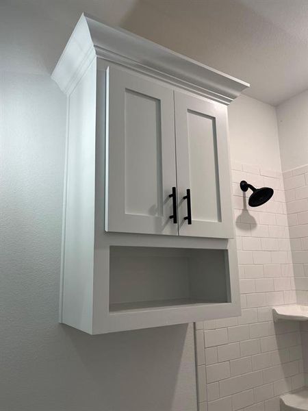 Full bath featuring tiled shower