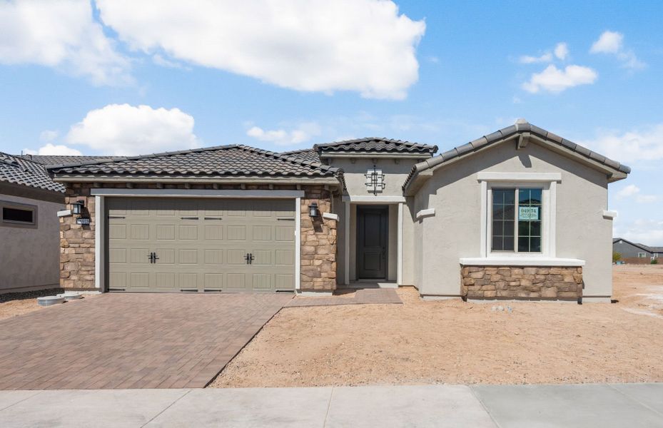 Front exterior of a new home in Sun City Festival, Buckeye, AZ, highlighting curb appeal (Image 23).