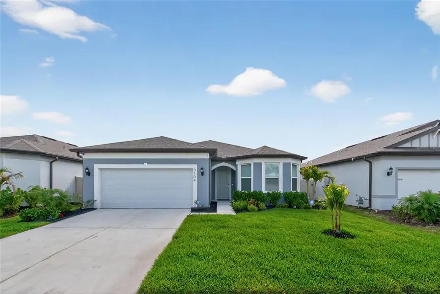 Front exterior of a new home in , Ellenton, FL, highlighting curb appeal (Image 29).