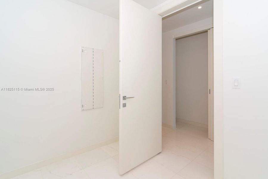 Spacious, unfurnished interior of a new home in Aston Martin Residences, Miami (Image 21).