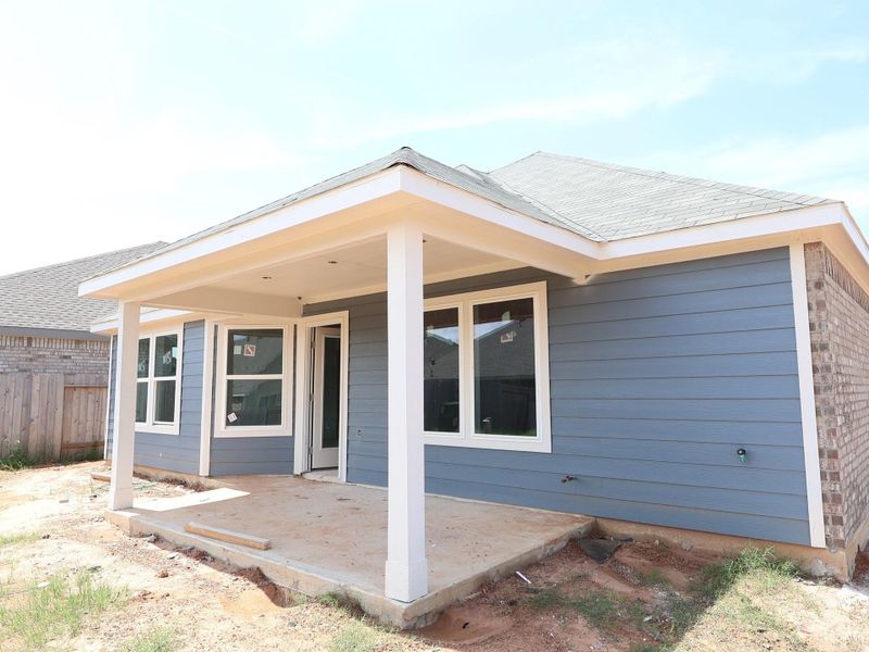 Front exterior of a new home in Magnolia Ridge, Magnolia, TX, highlighting curb appeal (Image 2). Front exterior of a new home in Magnolia Ridge, Magnolia, TX, highlighting curb appeal (Image 2).