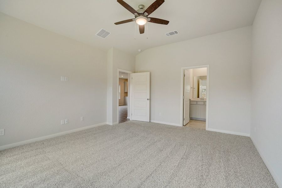 Primary suite bedroom in the Pearl floorplan at a Meritage Homes community.