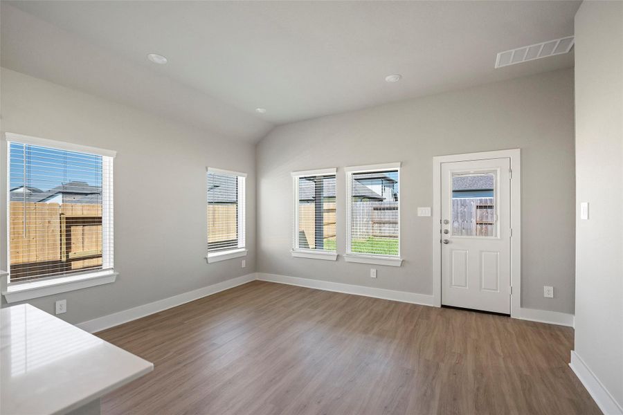 Large windows overlook thebackyard, adding warmth and charmto mealtime. Large windows overlook thebackyard, adding warmth and charmto mealtime.