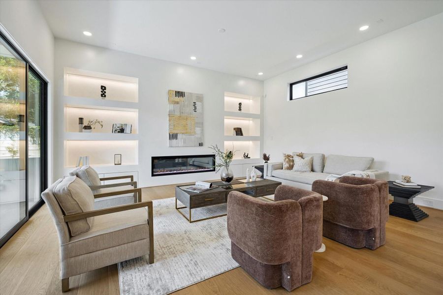 The fireplace is the stunning focal point in this living room, providing both warmth and a stylish design element. The fireplace is the stunning focal point in this living room, providing both warmth and a stylish design element.