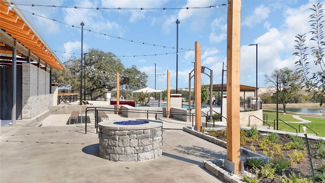 View of patio / terrace featuring a fire pit and a water view