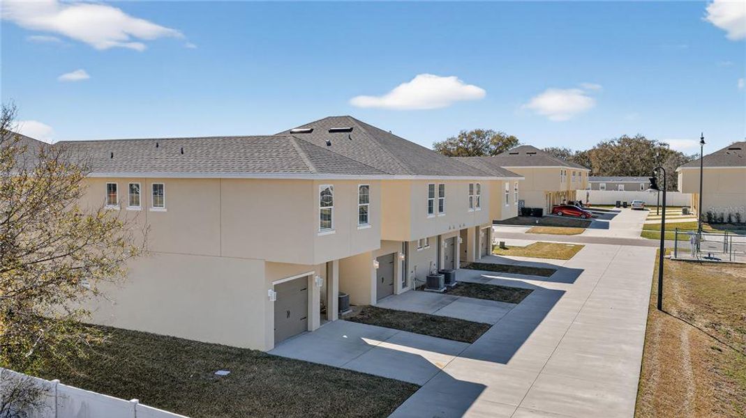 Front exterior of a new home in , Davenport, FL, highlighting curb appeal (Image 21).