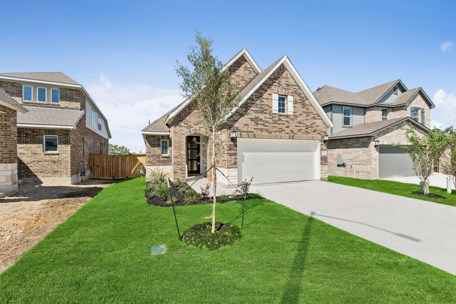 Front exterior of a new home in Mayfair - Select Garden Series, New Braunfels, TX, highlighting curb appeal (Image 2). Front exterior of a new home in Mayfair - Select Garden Series, New Braunfels, TX, highlighting curb appeal (Image 2).