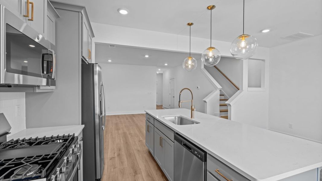 Accomplished design in a kitchen that blends function and form with a right-sized island at Silo Ridge in Anderson, SC